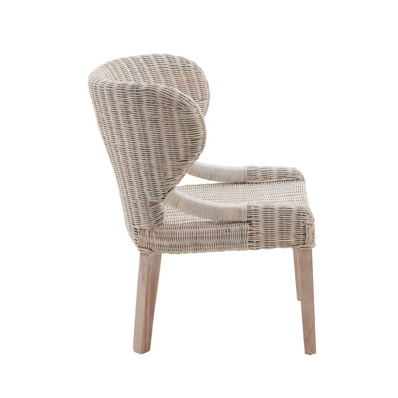 Wicker chair with a curved backrest and light-colored upholstery, featuring wooden legs and a textured design