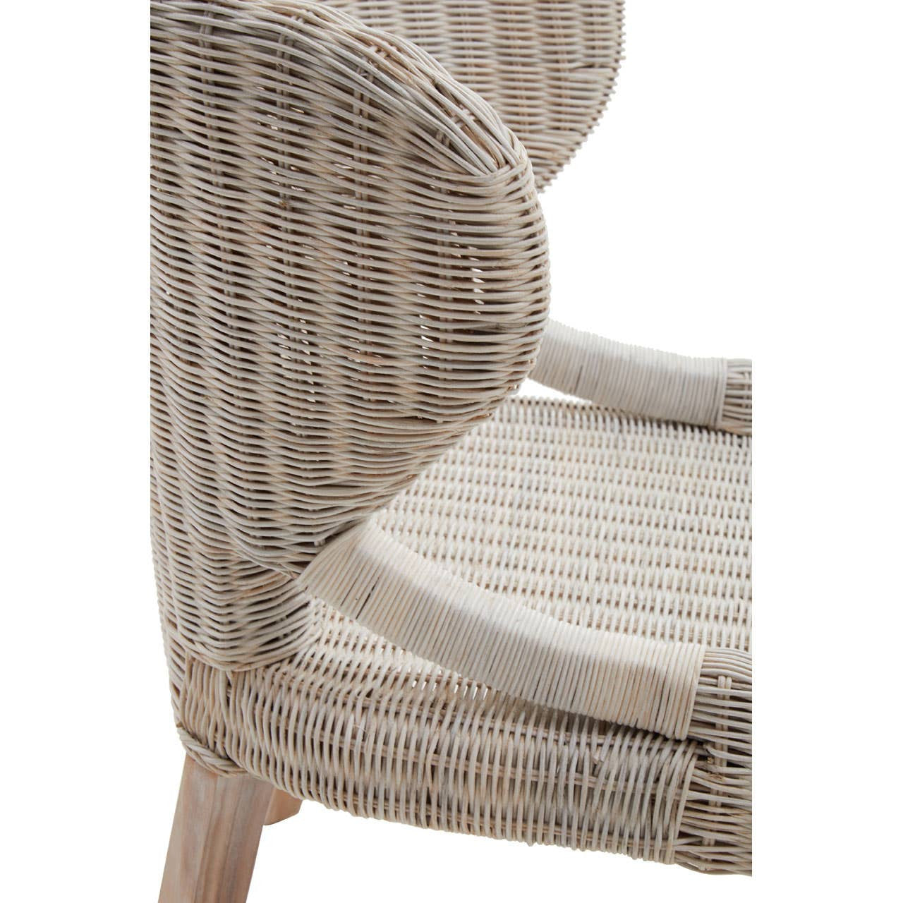 Wicker chair featuring a curved backrest and a textured seat, with light-colored woven material and wooden legs. The design showcases a natural, organic aesthetic suitable for home decor