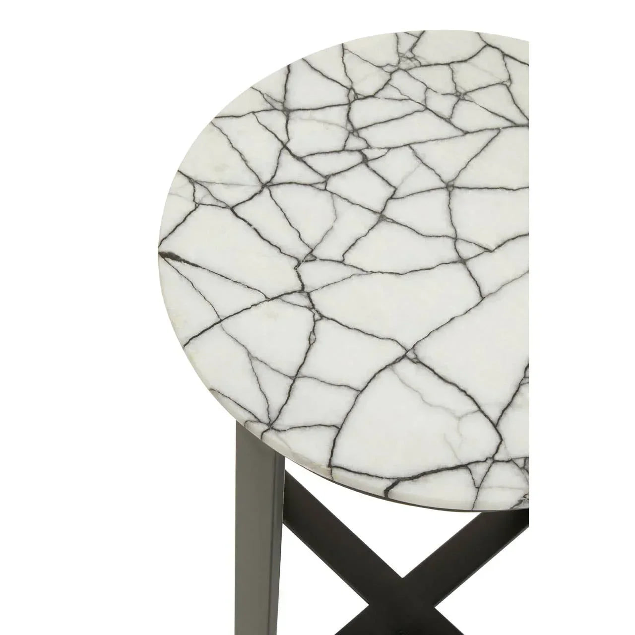 Round marble side table with black metal legs and white veined tabletop close-up