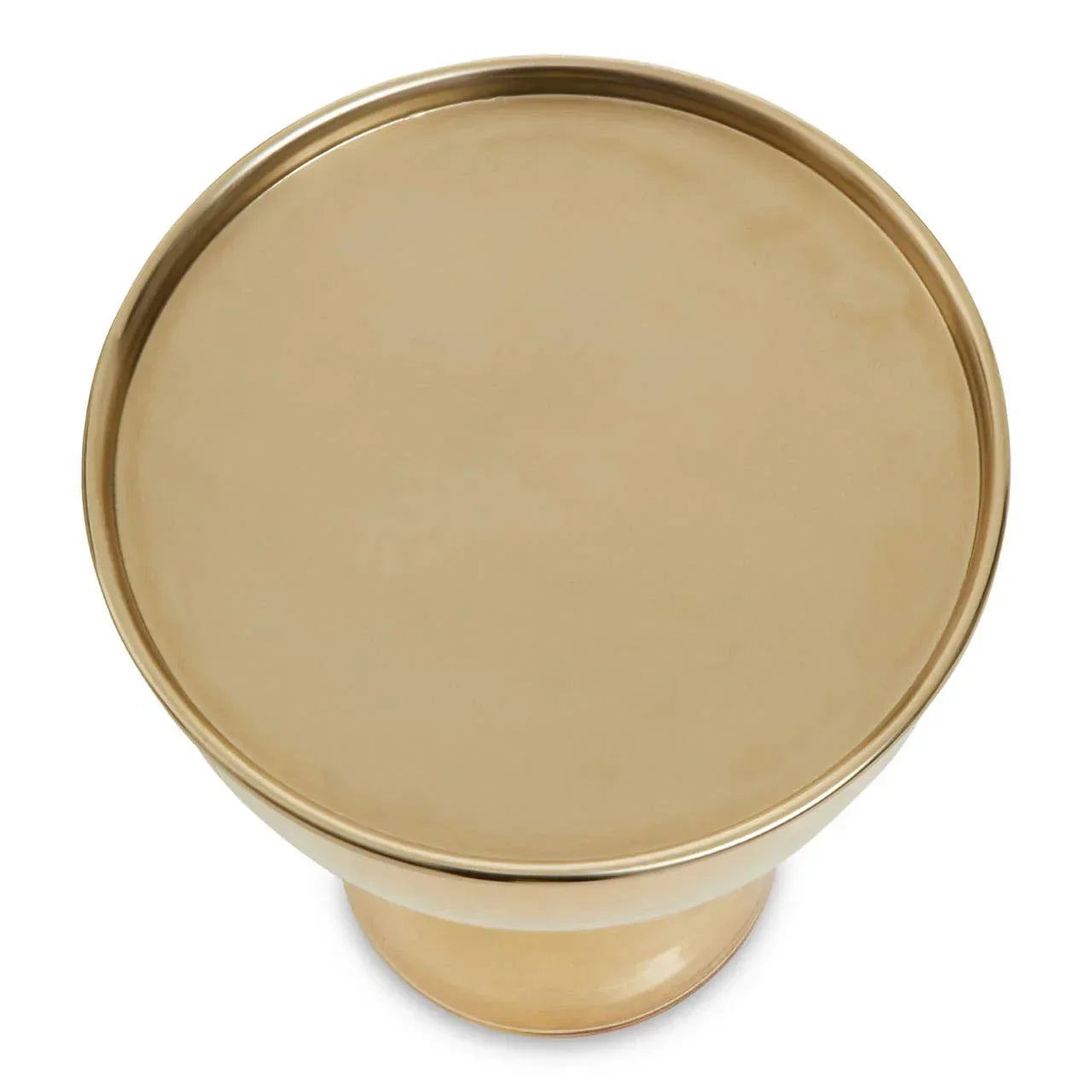 Round gold metal side table with smooth top surface, viewed from above