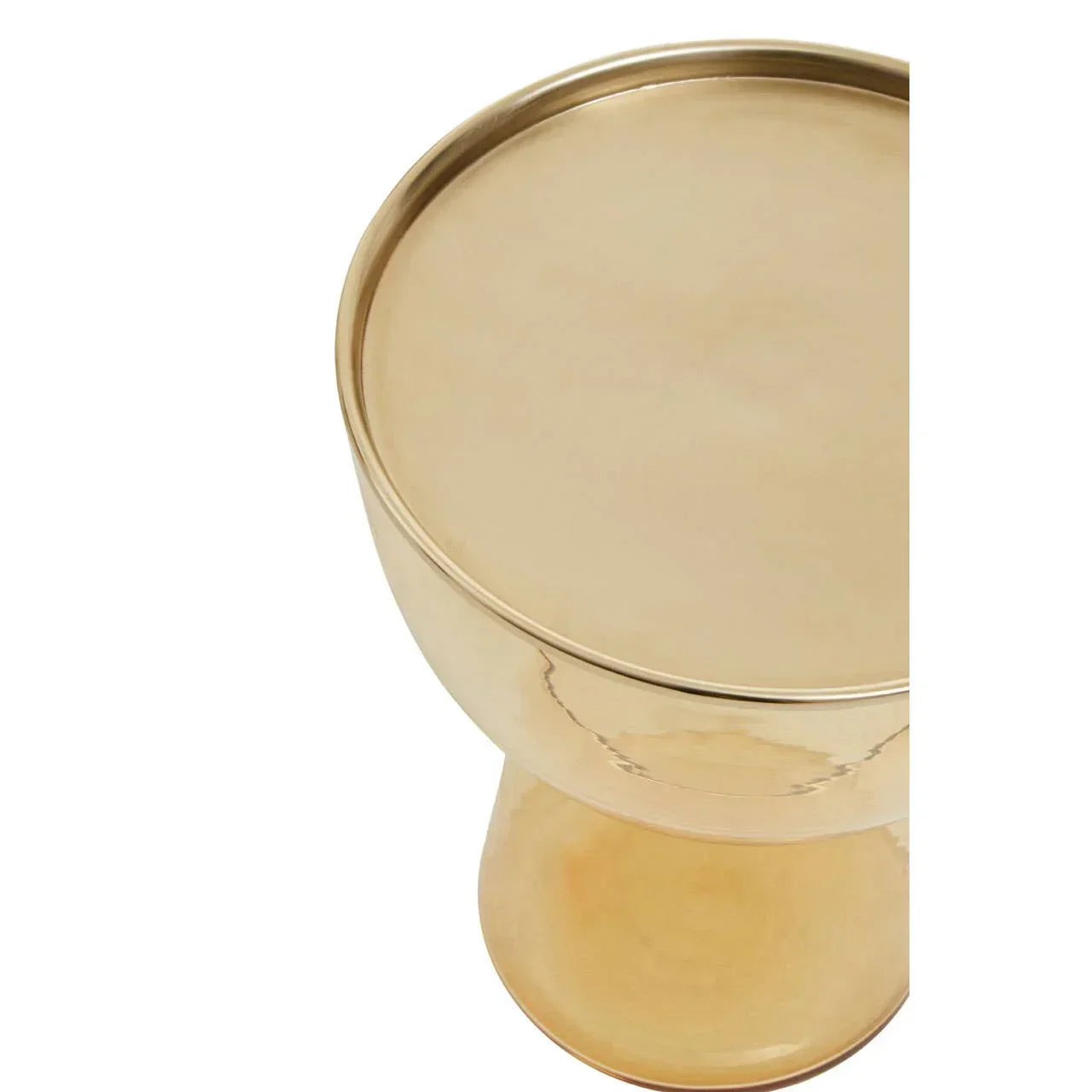 Round gold metal accent table with curved base and smooth top, partial overhead view