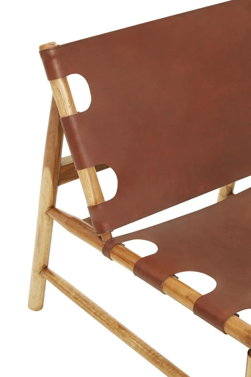 Side view of wooden lounge chair with brown leather seat and backrest