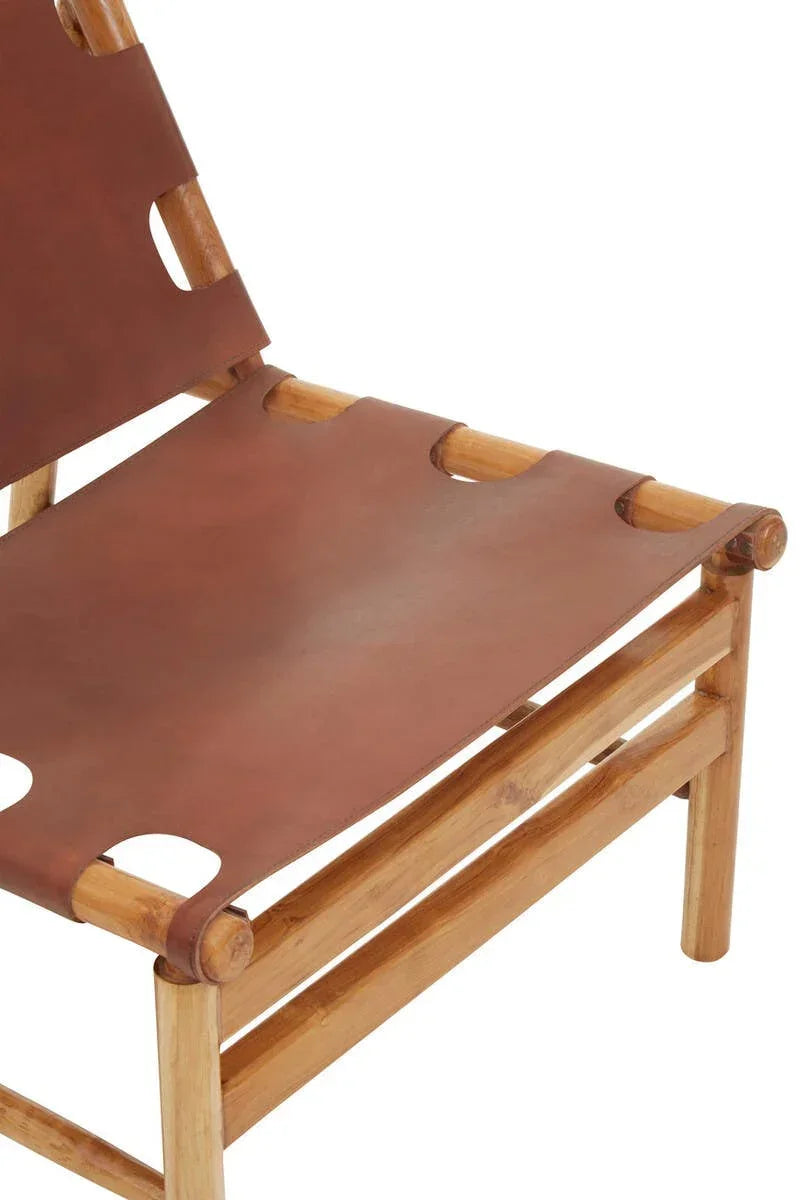 Closeup of wooden accent chair with brown leather seat and backrest