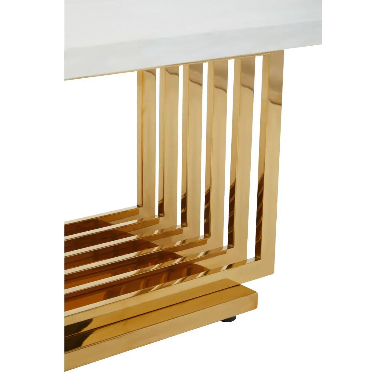Gold metal dining table base with geometric design and white marble tabletop corner
