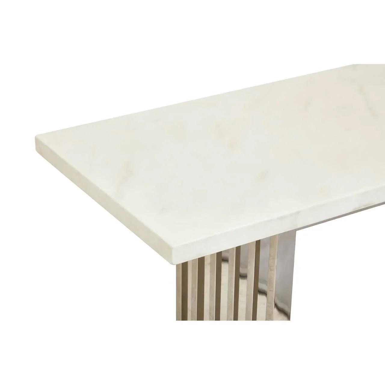 Rectangular marble dining table with polished stainless steel legs, corner angle view