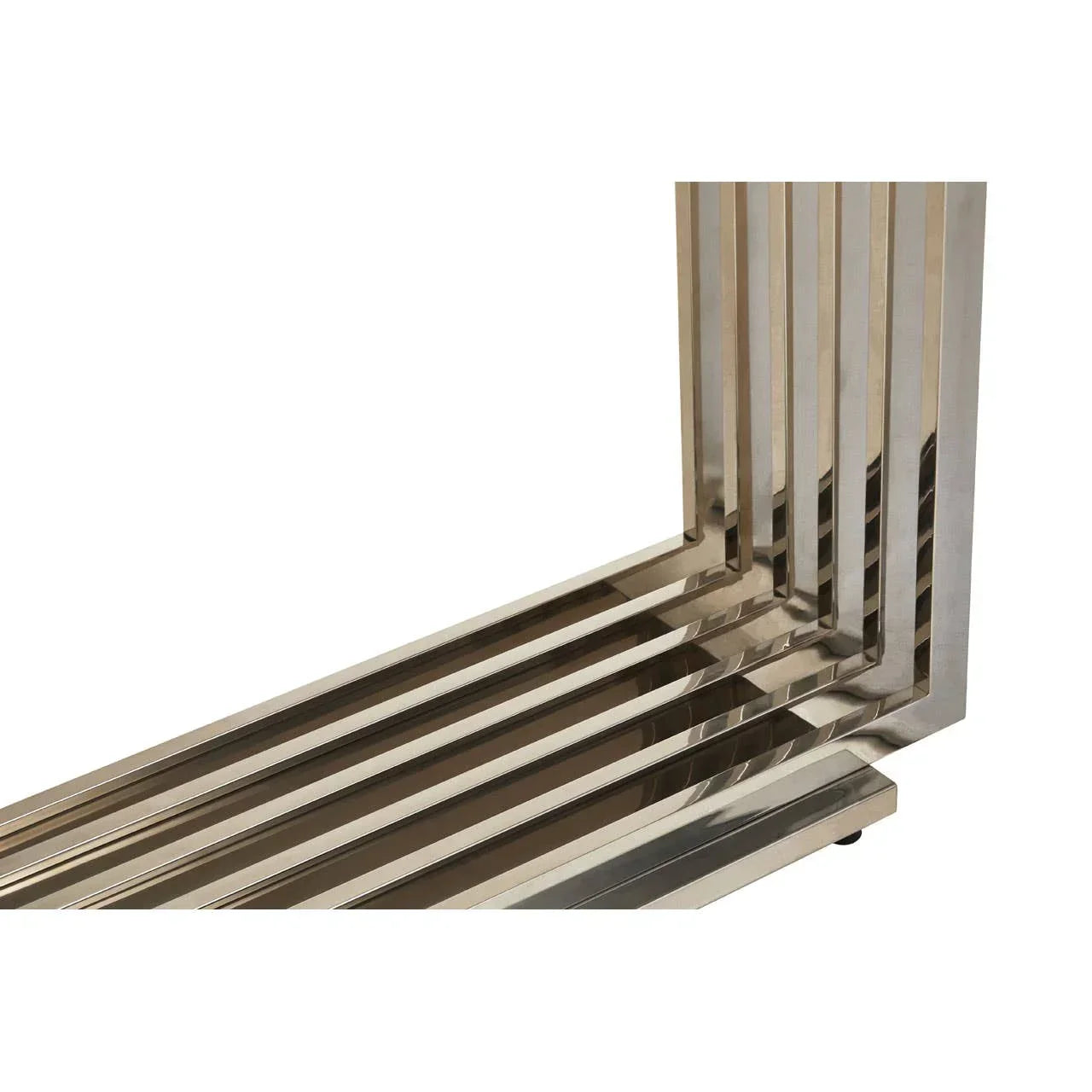 Chrome metal table base with geometric linear design, close-up corner view