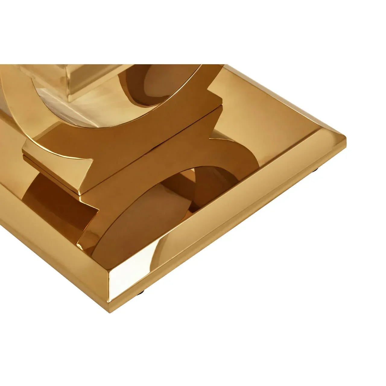 Closeup of gold metal coffee table base with modern geometric design