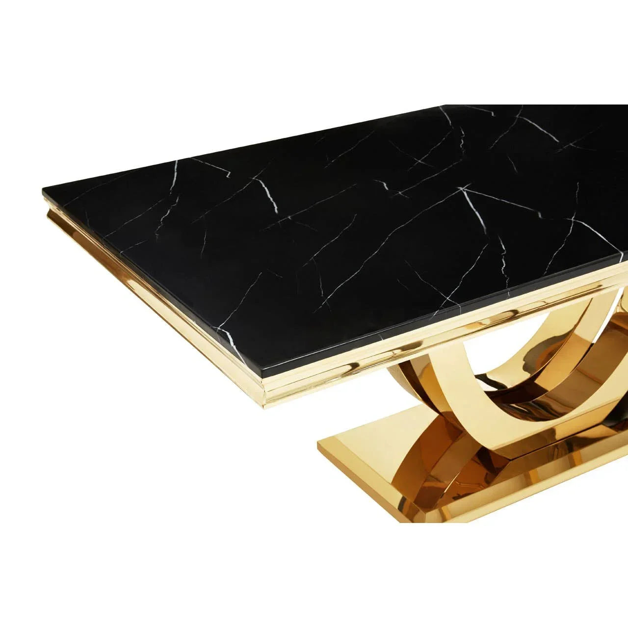 Black marble dining table with gold stainless steel base, close-up of corner detail