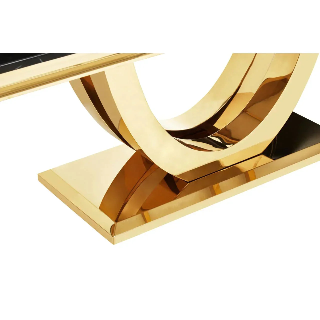 Gold metal dining table base with geometric curved design and rectangular base detail