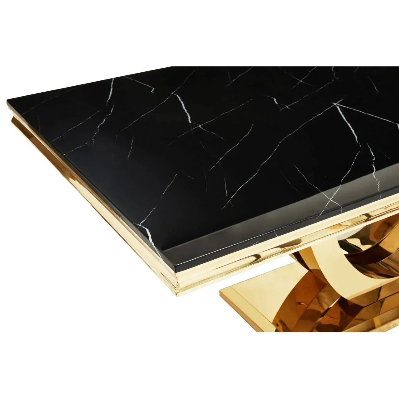 Black marble dining table with gold metal base, close-up of tabletop edge and support