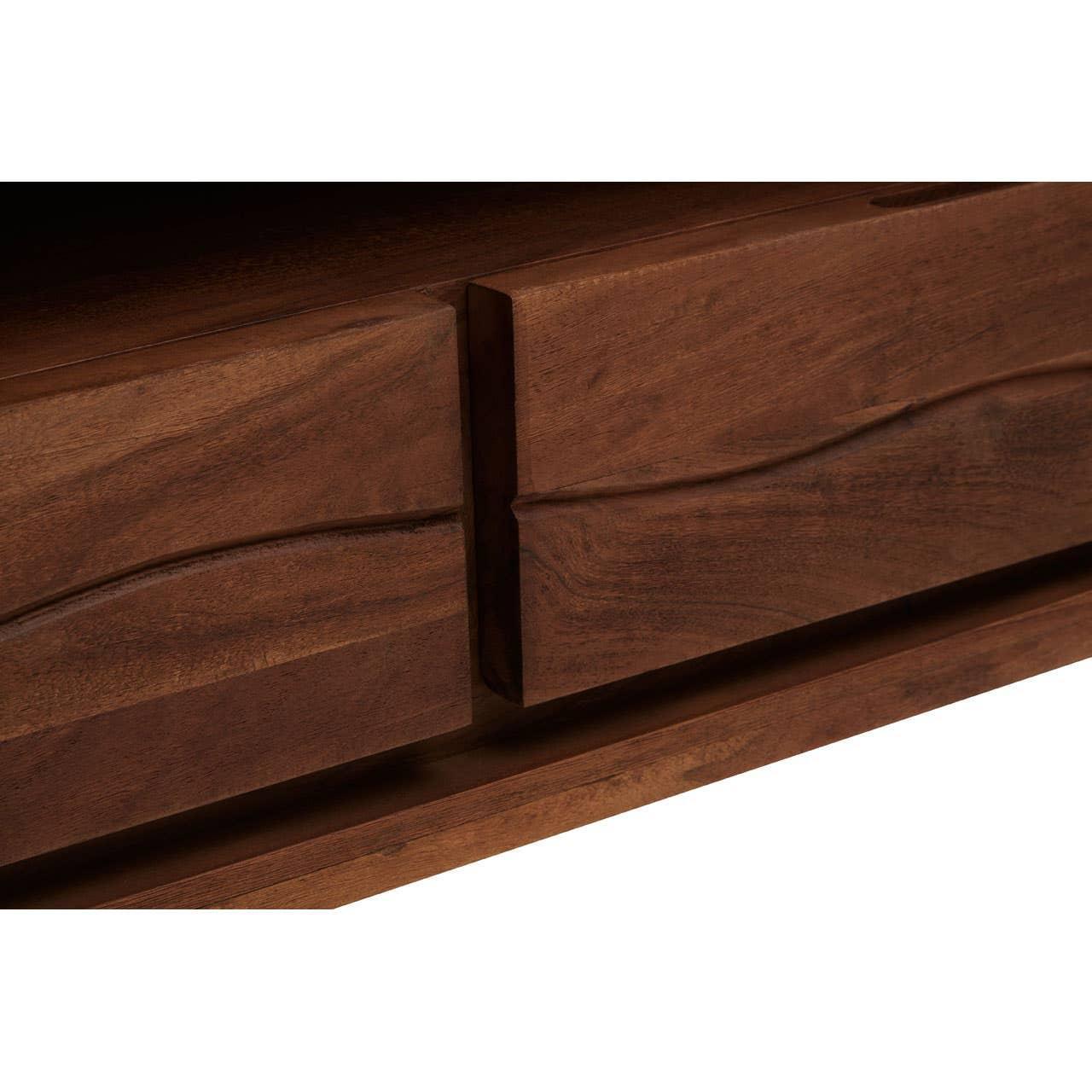 Closeup of wooden sideboard drawers with carved handle detail