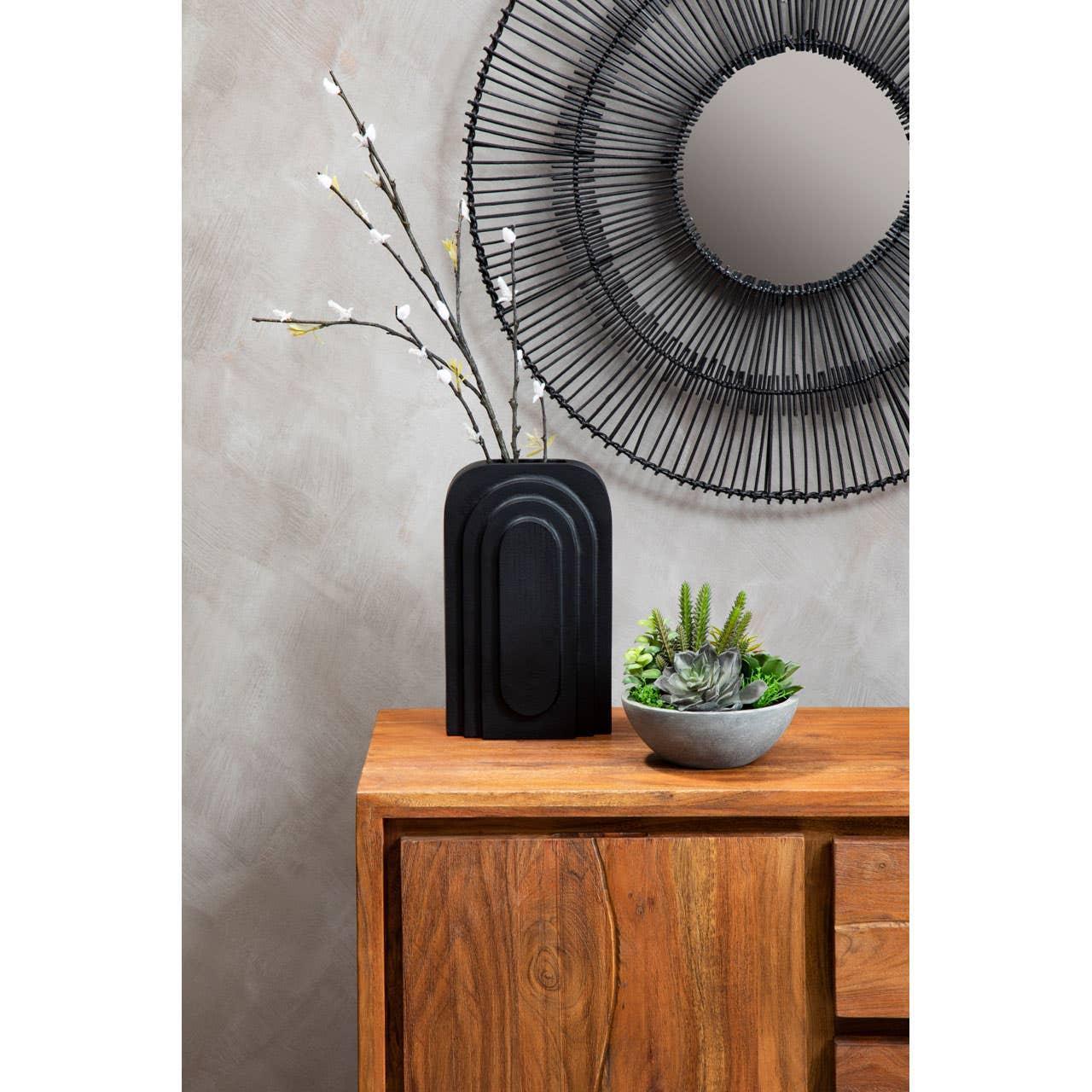 Solid wood sideboard with modern black vase, artificial flowers, round wall mirror