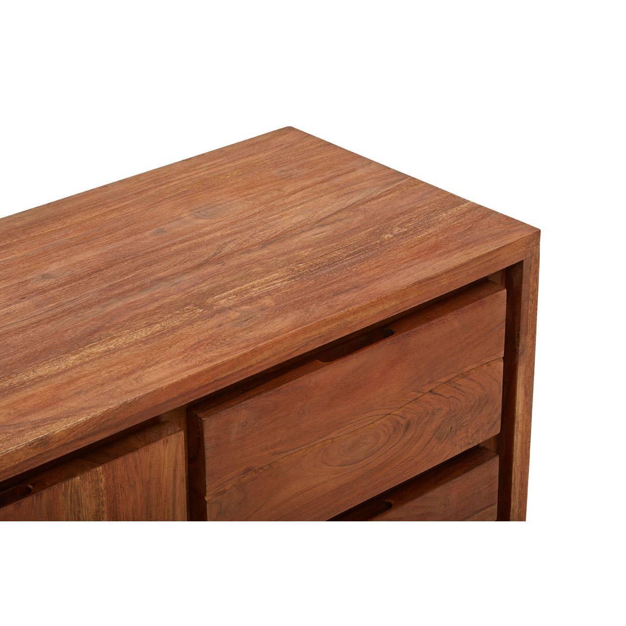 Close up of wooden chest of drawers with smooth finish and visible wood grain