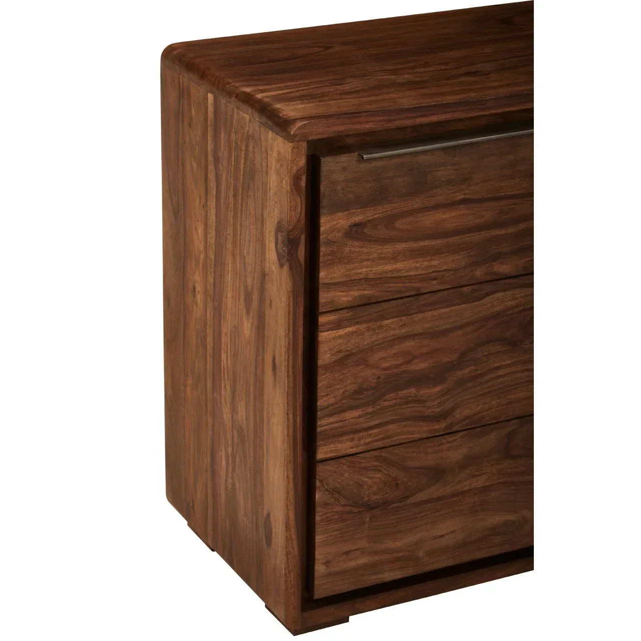 Closeup of wooden chest of drawers with natural grain finish and metal handle