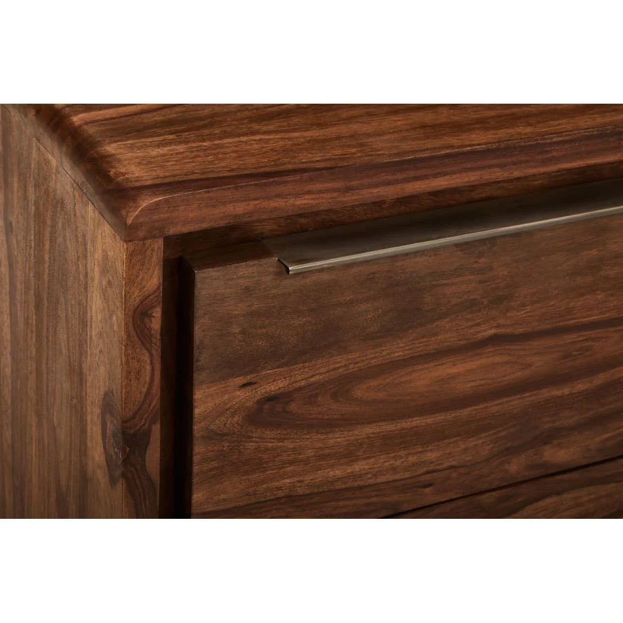 Solid wood chest of drawers with metal handle, close-up of grain detail and corner