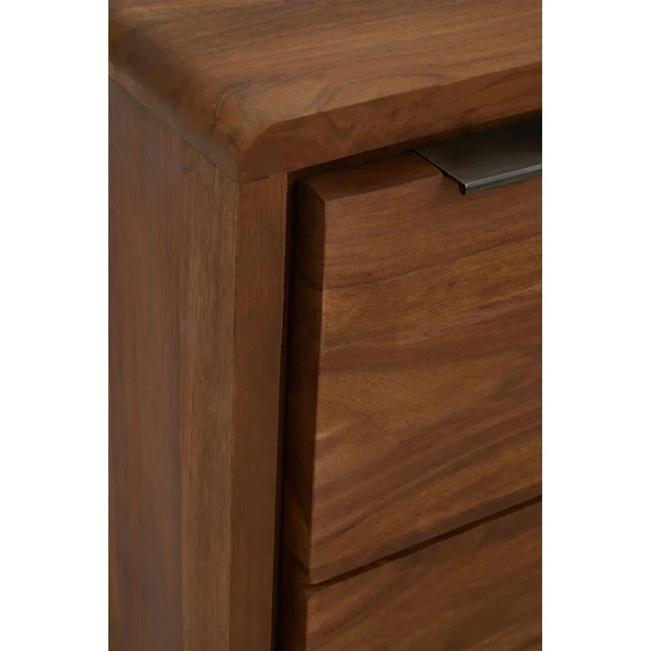 Closeup of wooden chest of drawers corner with smooth finish and modern metal handle