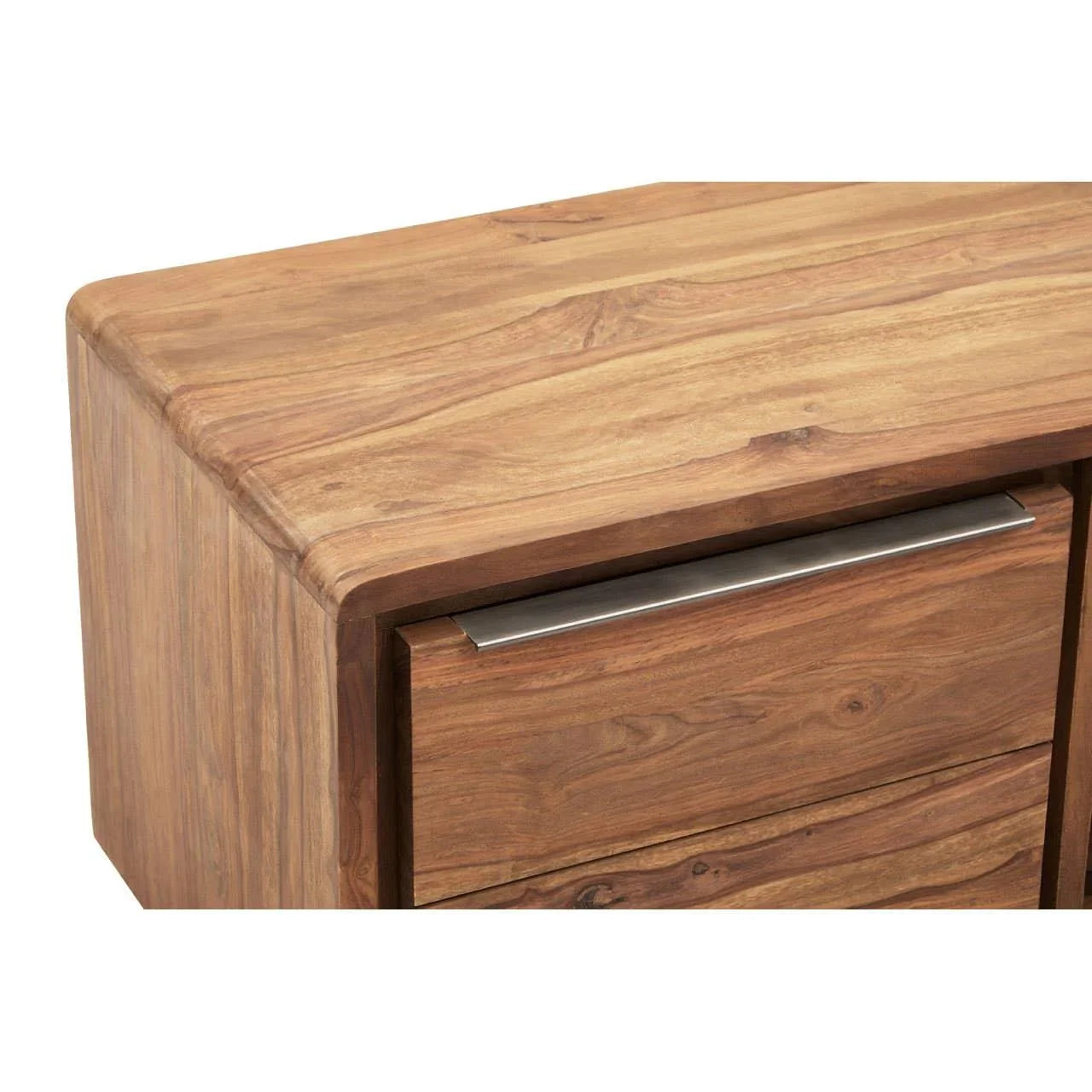 Closeup of wooden chest of drawers with metal handle and natural grain finish