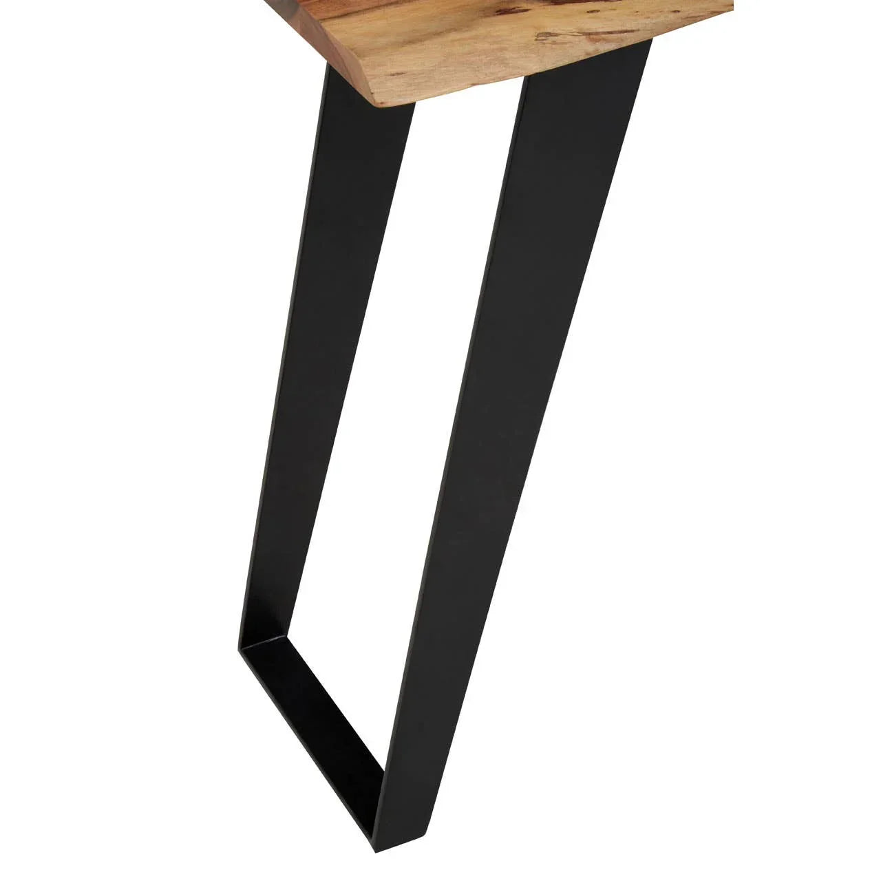 Close view of wooden tabletop with black metal dining table legs
