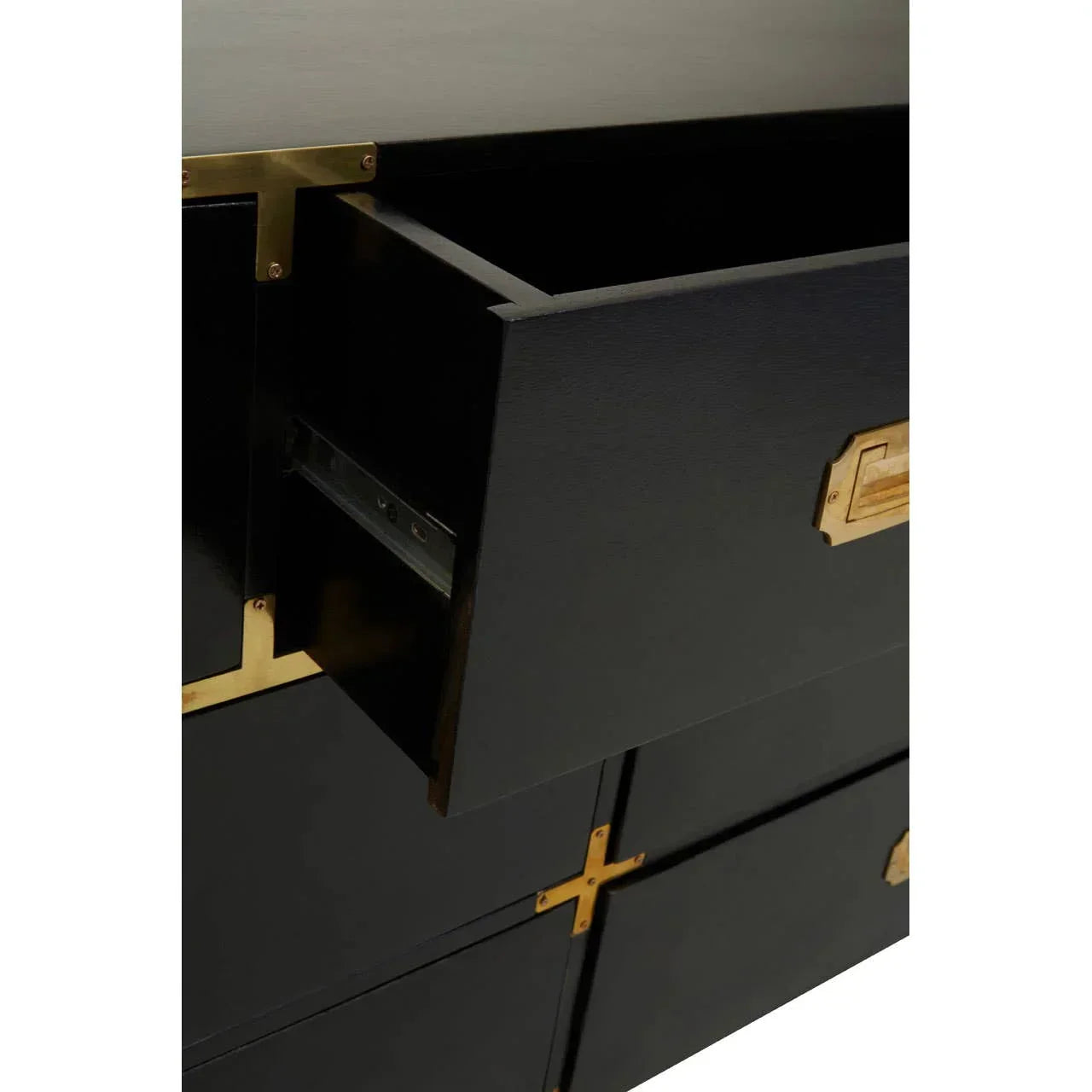 Black chest of drawers with gold handles and open top drawer detail