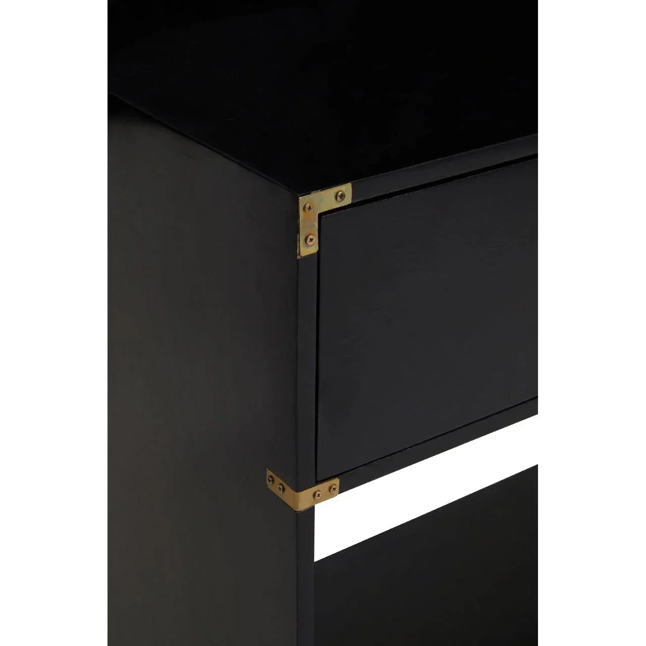 Black wooden cabinet with brass corner brackets, close-up of drawer and side panel