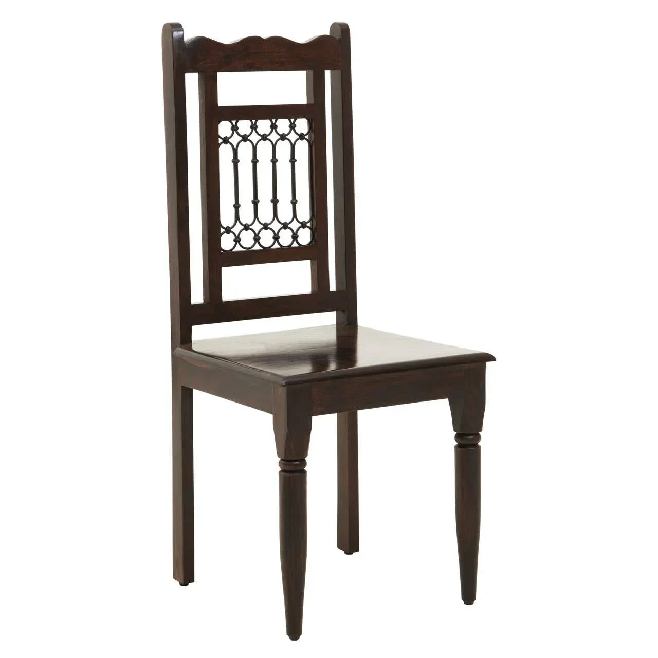 Dark wood dining chair with carved backrest and turned front legs, side angle view