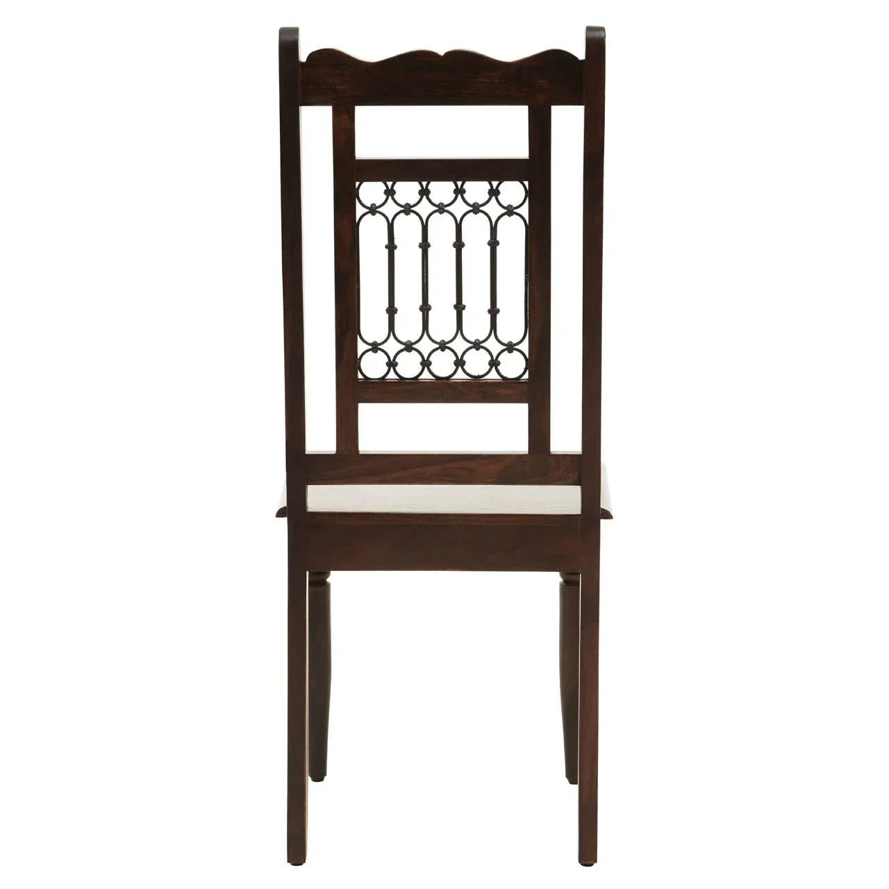 Dark wood dining chair with ornate metal backrest detail, rear view