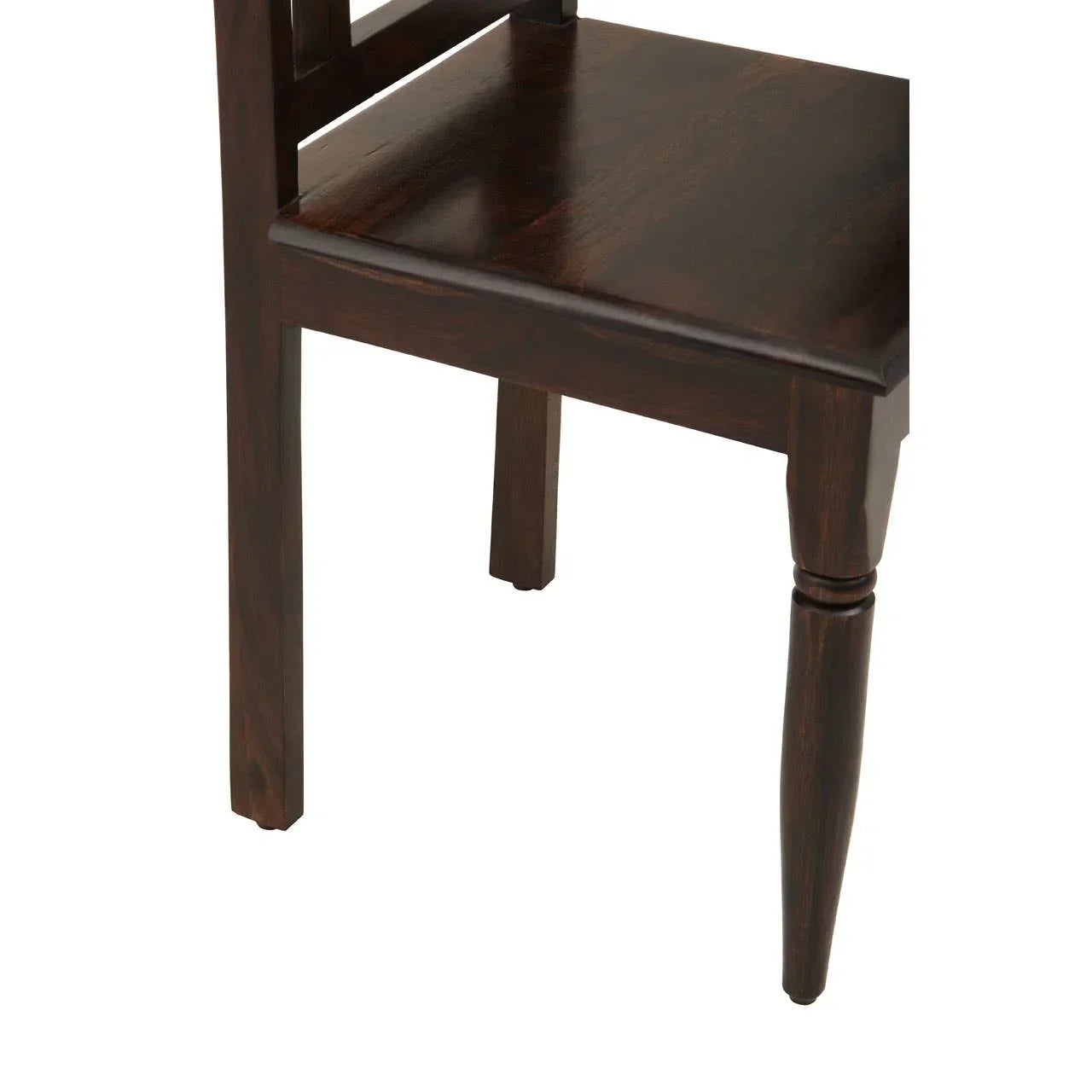 Close view of dark wood dining chair with turned leg and smooth seat finish