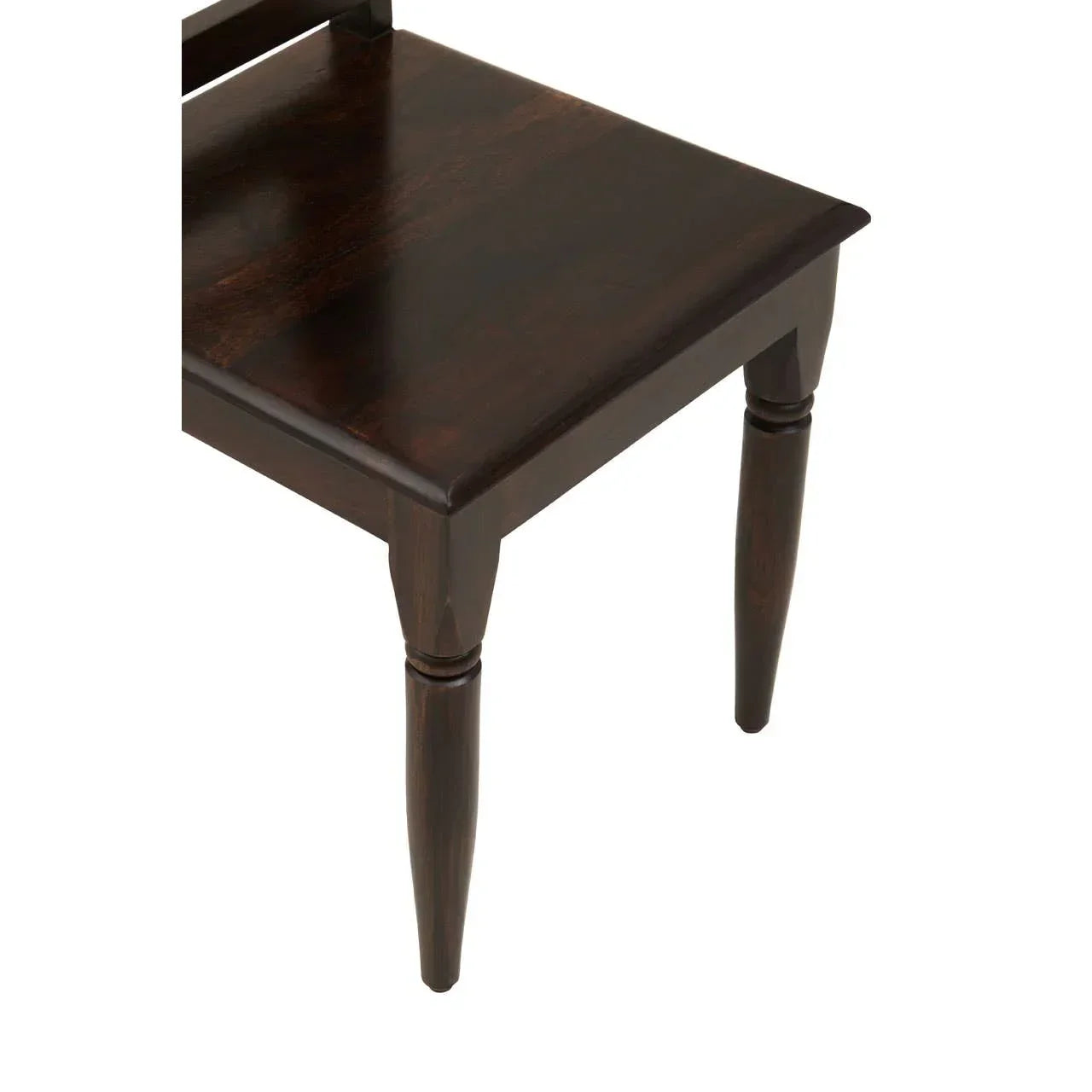 Dark wood dining chair seat and turned legs close-up
