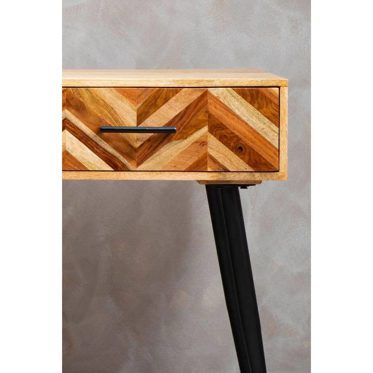 Chevron patterned wood console table with black metal leg and drawer handle