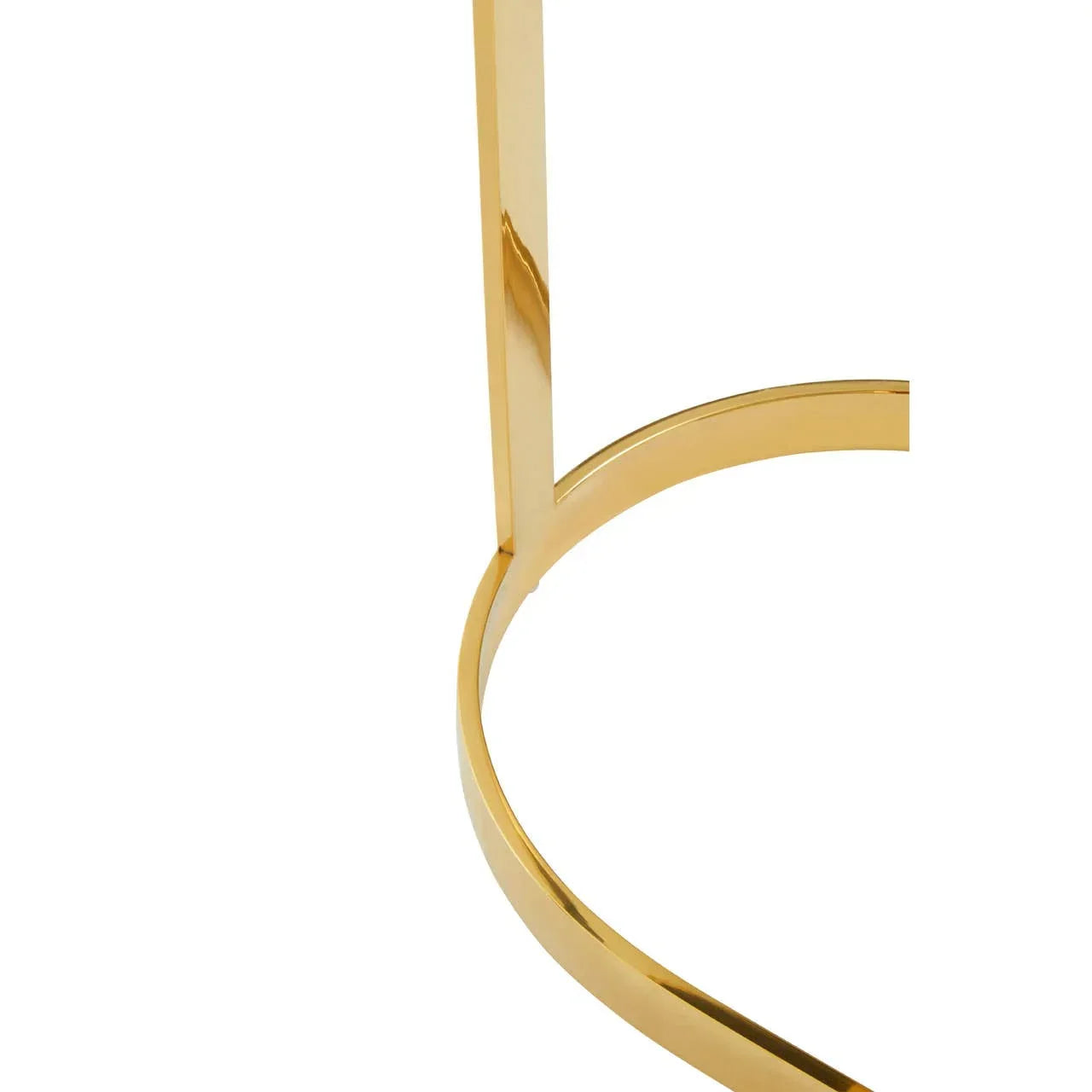 Gold metal table leg with curved base, close-up view of furniture detail