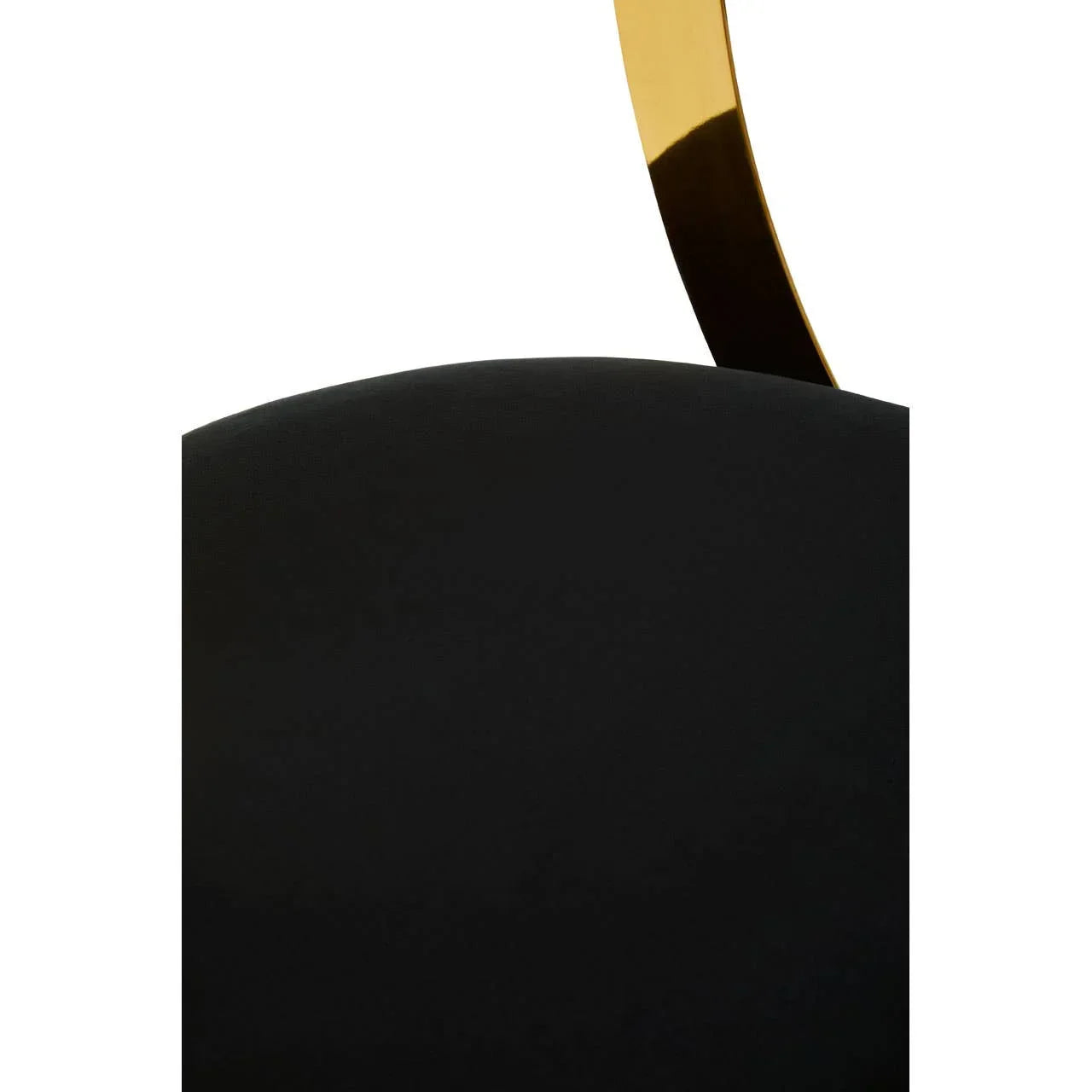 Black velvet dining chair backrest with curved gold metal accent