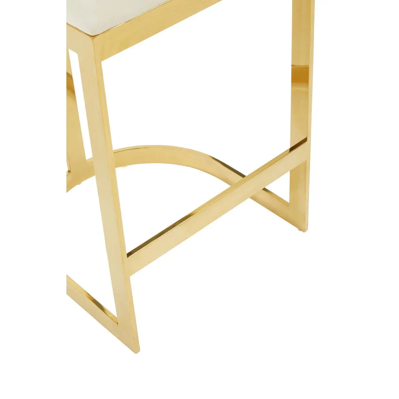 Gold metal side table frame with geometric leg design and marble top corner detail