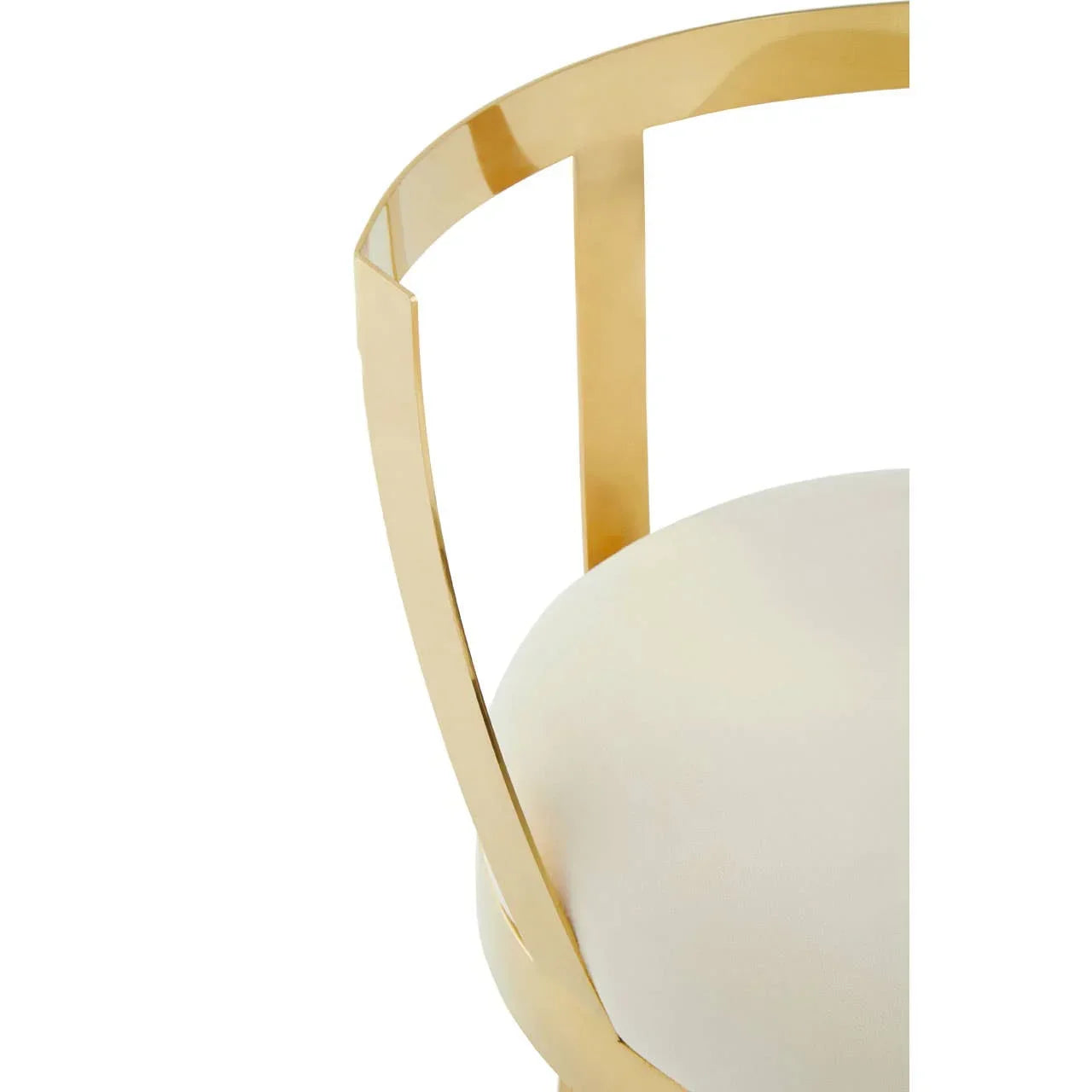 Gold metal dining chair frame with cream upholstered seat close-up