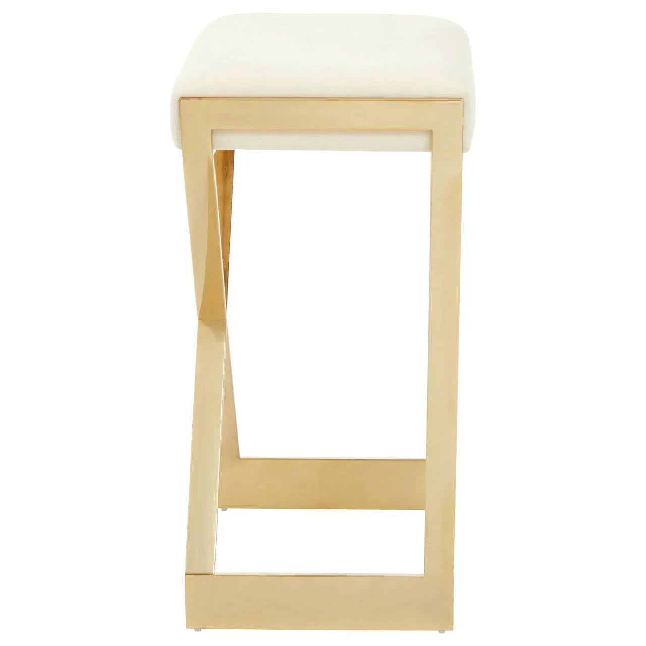 Side view of gold metal bar stool with cream upholstered seat