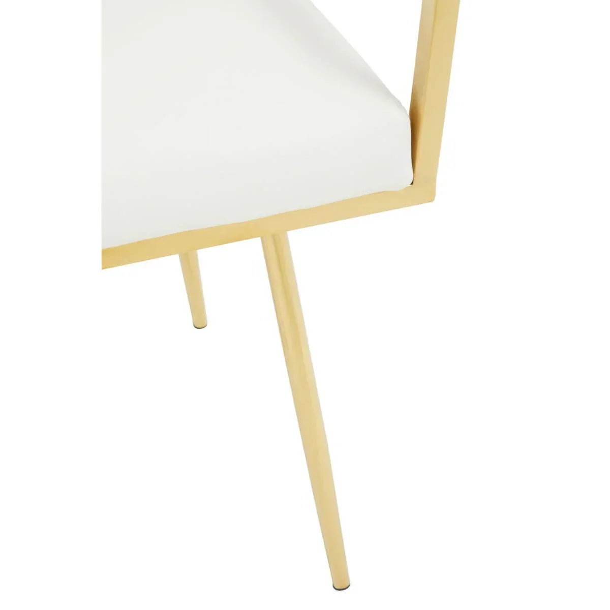 White dining chair with gold metal frame and slim angled legs close-up