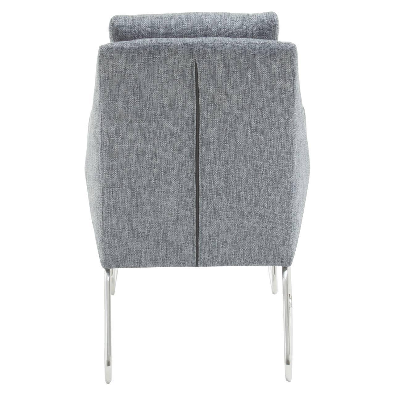 Back view of grey fabric armchair with chrome legs and linear seam detail