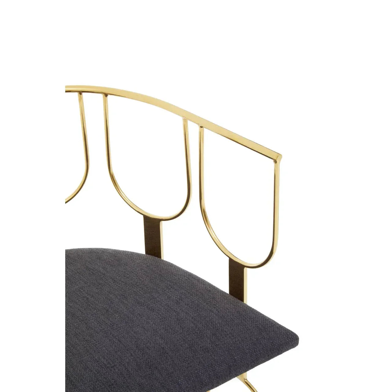 Gold metal chair frame with curved design and grey fabric seat detail