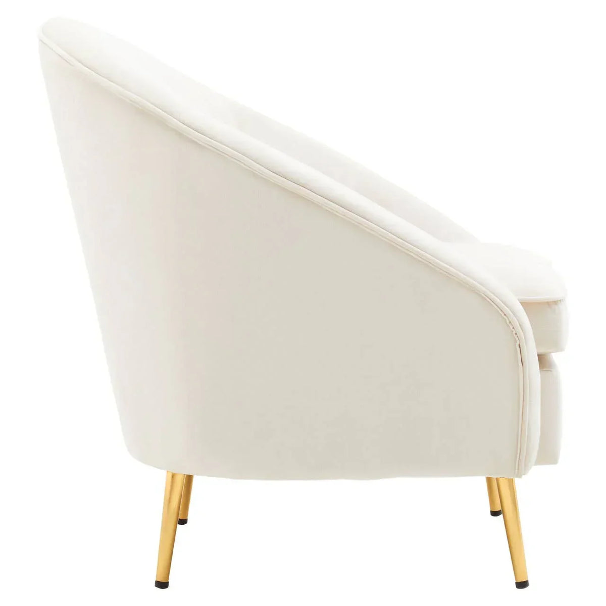 Side angle of cream accent chair with velvet upholstery and gold metal legs