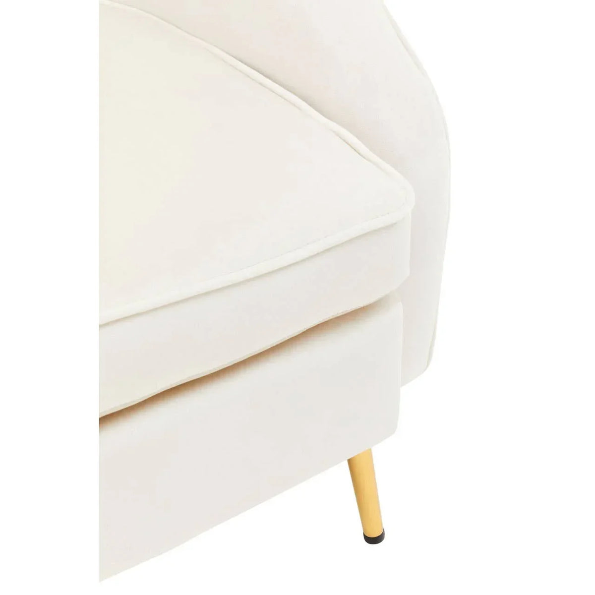 Cream sofa corner with plush cushion and wooden leg detail