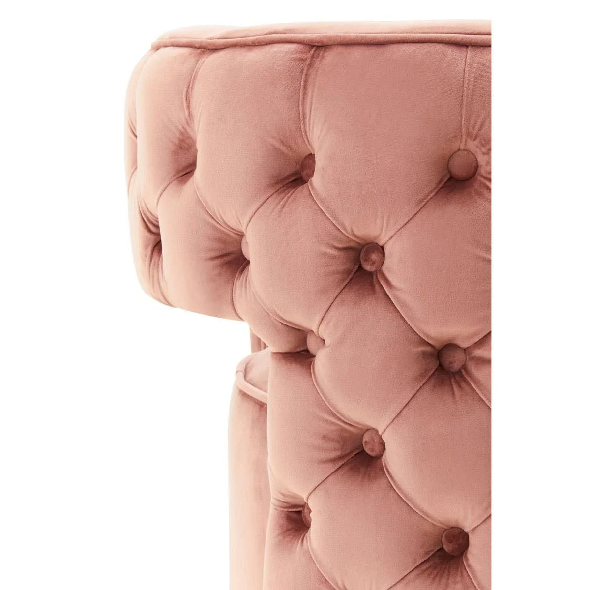 Pink velvet sofa armrest with deep button tufting and plush upholstery