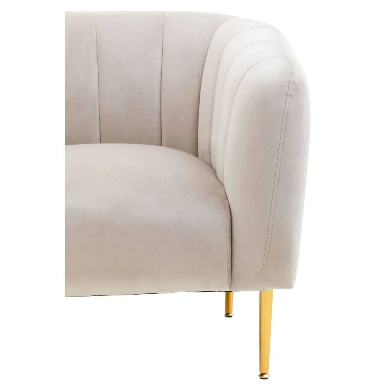 Beige velvet accent chair with scalloped backrest and gold metal legs, corner detail view