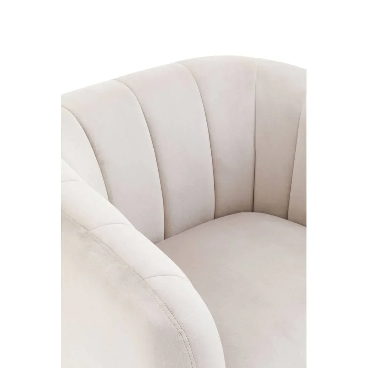 Closeup of cream fabric armchair with vertical stitched backrest and curved arms