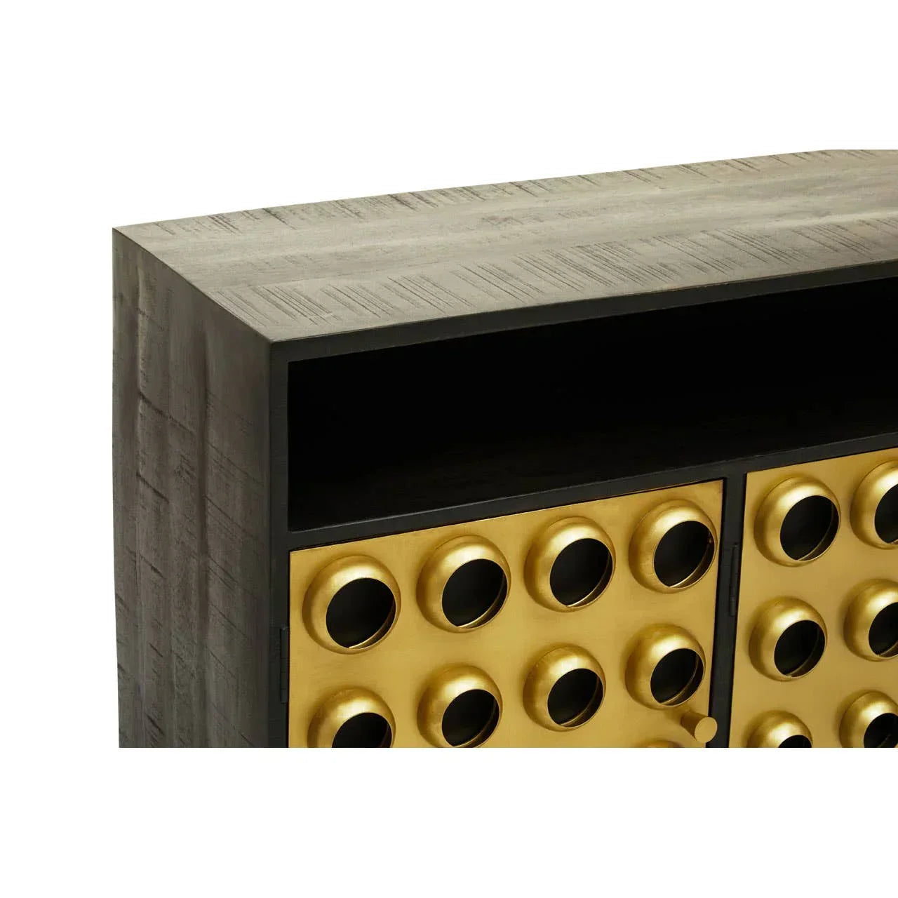 Wooden cabinet with gold circle pattern doors and open shelf, close-up detail view