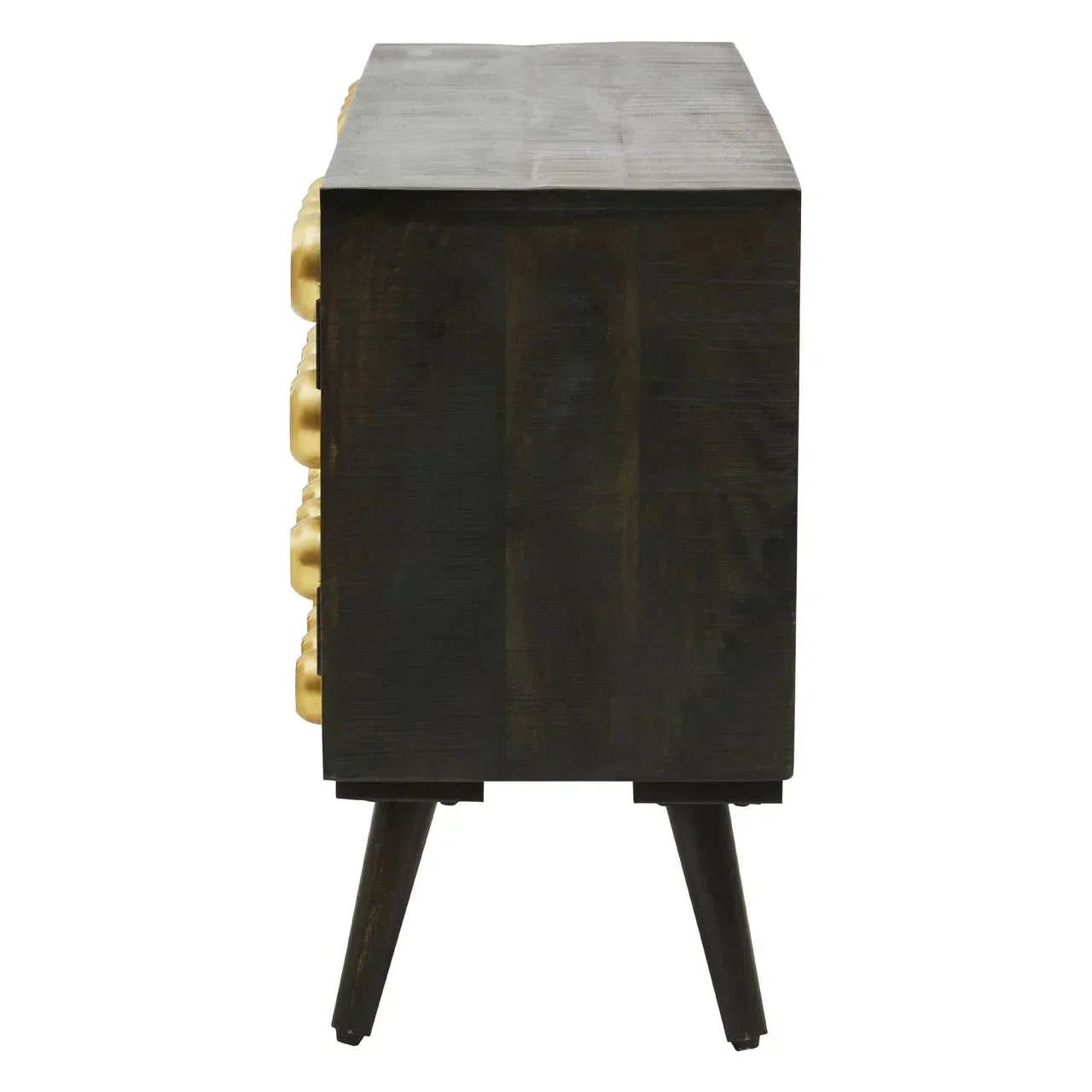 Side view of dark wood chest of drawers with angled legs and gold drawer fronts