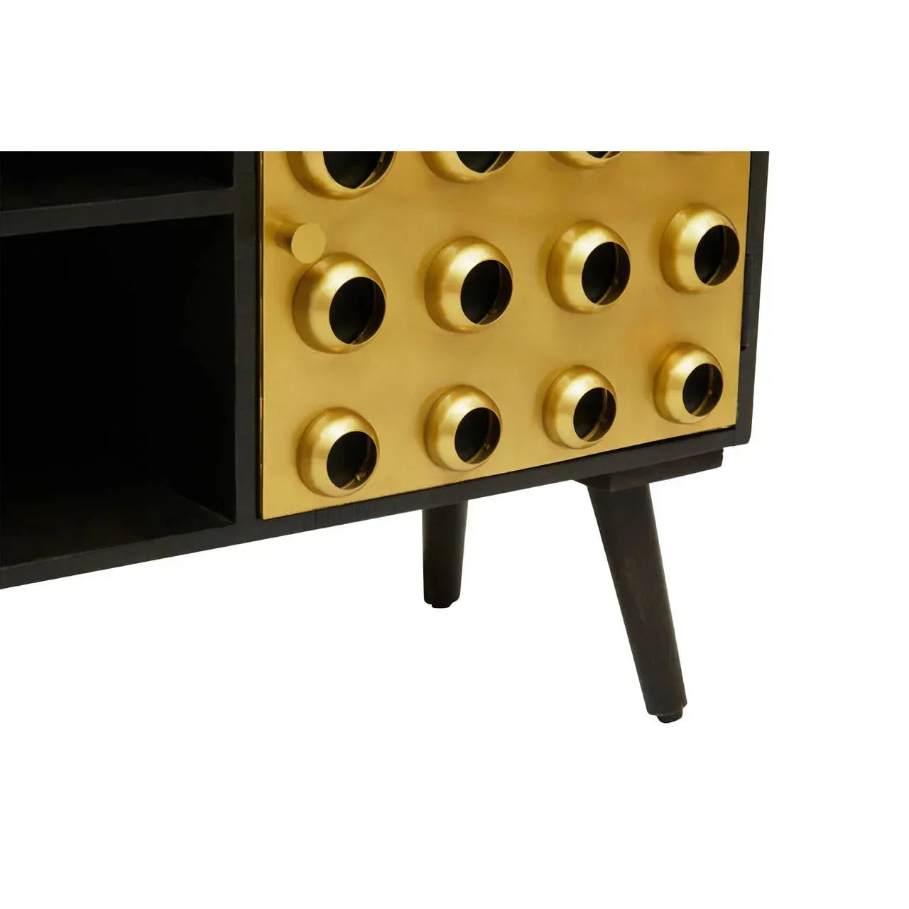 Closeup of modern sideboard with gold metal circular detail and black wooden legs