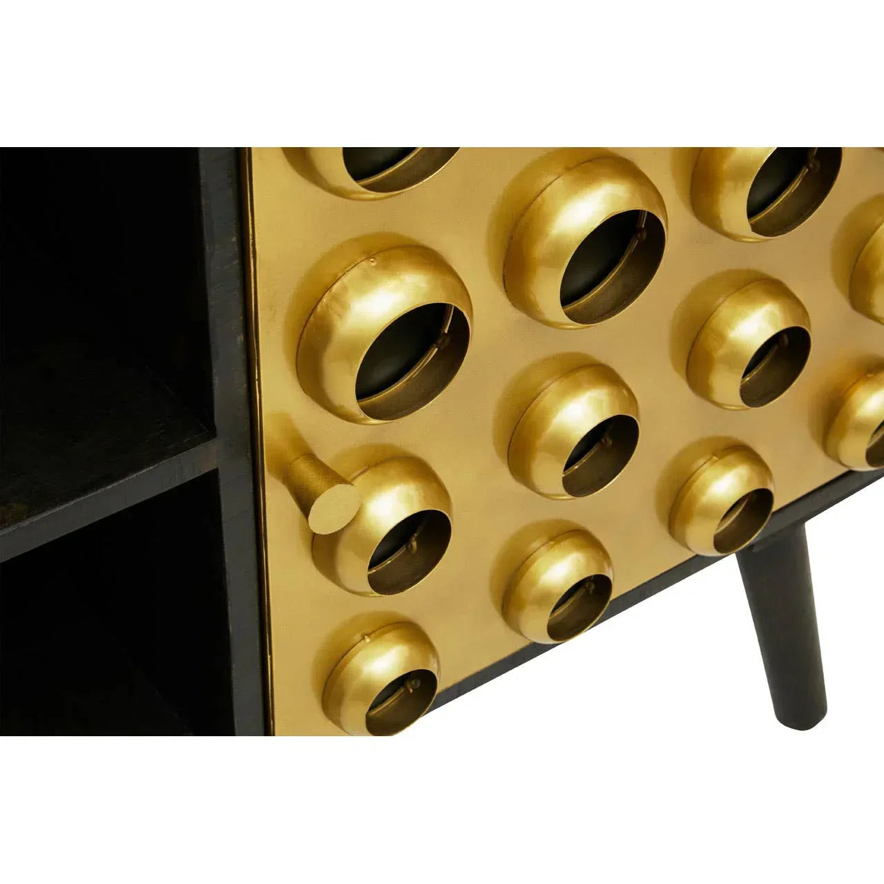 Gold and black sideboard with circular brass drawer fronts and modern handle detail