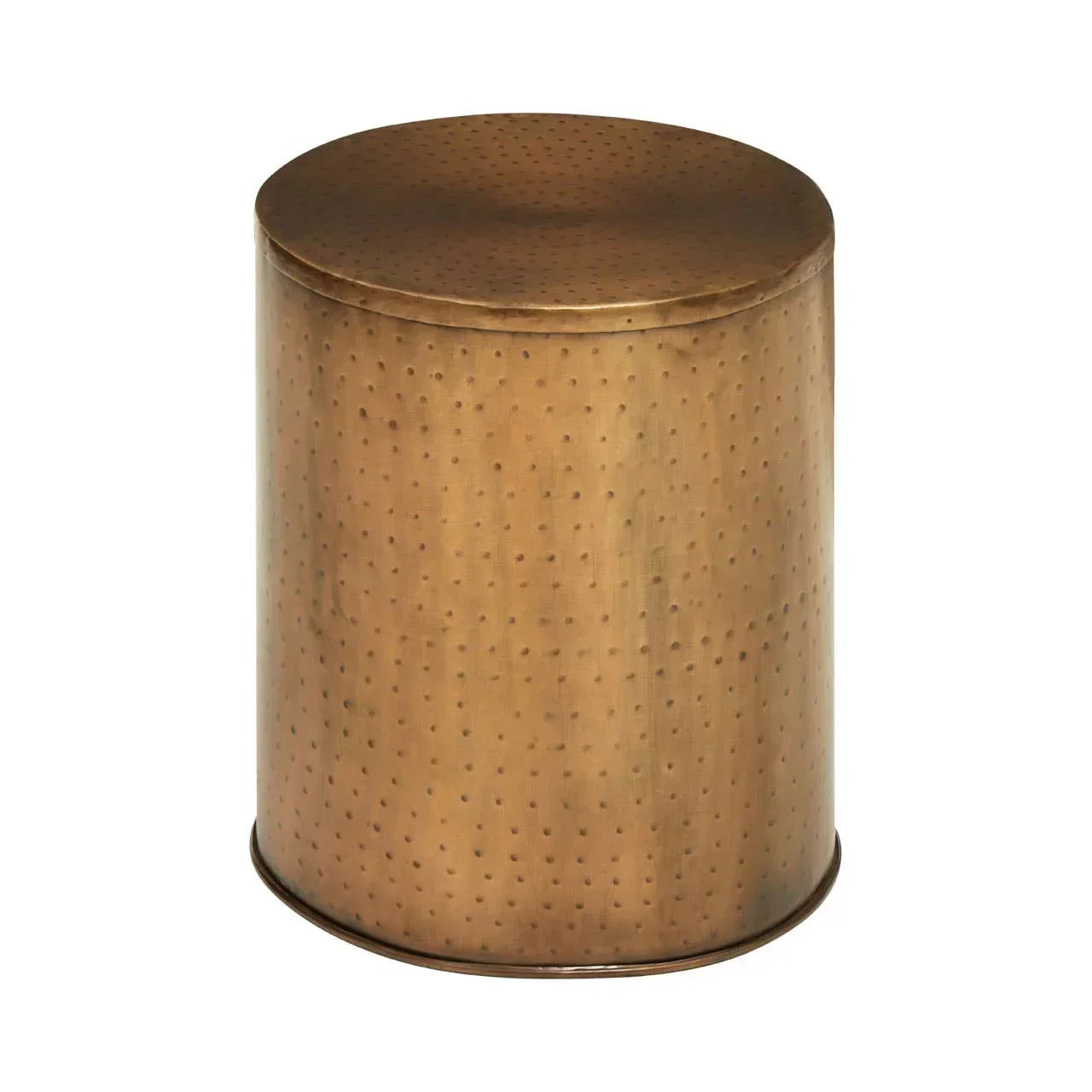 Round hammered metal side table in brushed brass finish, isolated on white