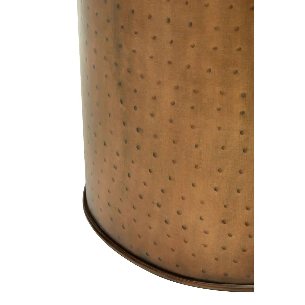 Close-up of hammered copper metal side table base with dotted texture