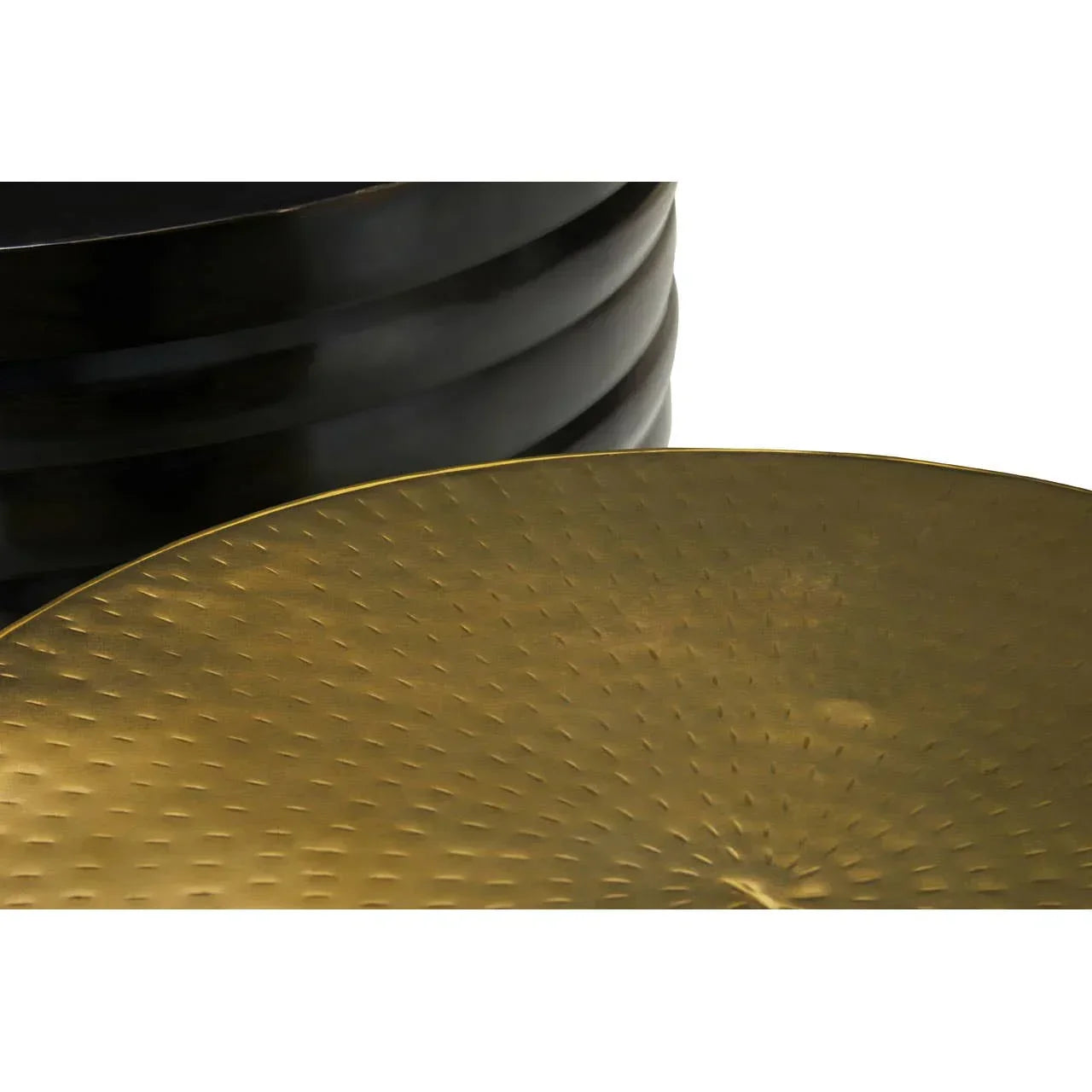 Close up of black metal frame with textured gold coffee table top
