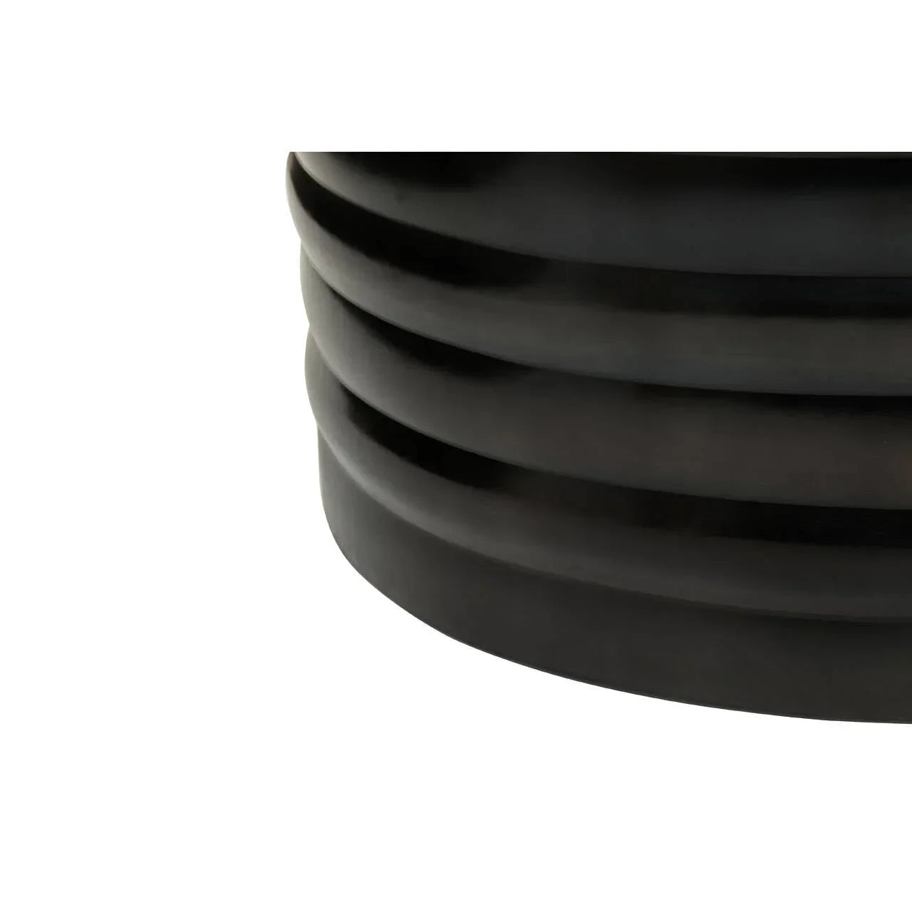 Close-up of black ribbed ceramic planter base detail